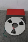 Ampex Red-black 10.5" Metal 1/4" Reel To Box Used. Fixed Price $28.00.